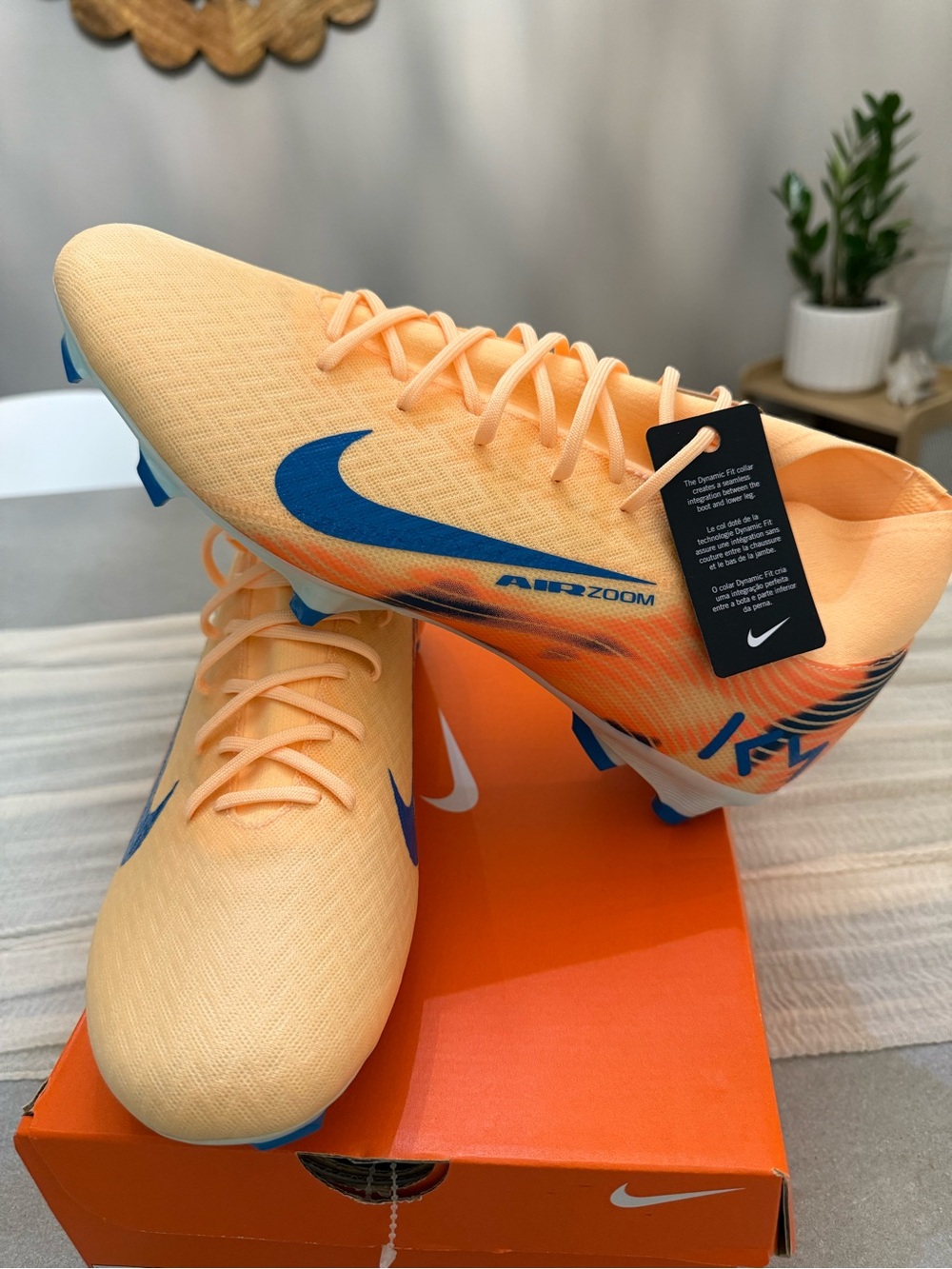 Nike Peach Soccer Cleats with Blue Swoosh